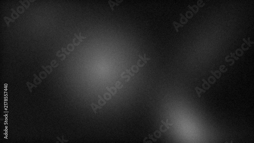 Abstract dark background with soft glowing light patches creating a mysterious atmosphere for modern graphic design projects and textures