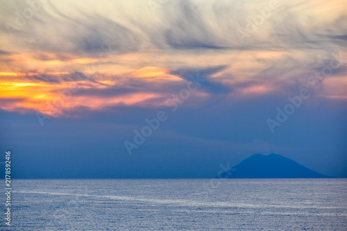 Bild auf Leinwand Sunset with the Stromboli volcano erupting, Tropea, Italy