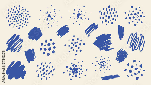 Hand drawn blue scribble and dot vector elements set with abstract brush strokes and paint splatters on cream background
