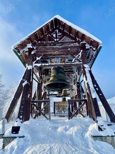 Bild auf Leinwand Belogorsky St Nicholas Monastery church bell tower in winter, Perm Krai