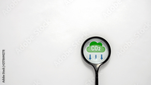 Canvastavla Carbon Dioxide CO2 Emission Reduction and Climate Change Concept with Magnifying