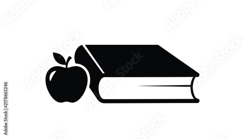 Black silhouette of academic textbook next to fresh apple symbolizing education school knowledge and learning.