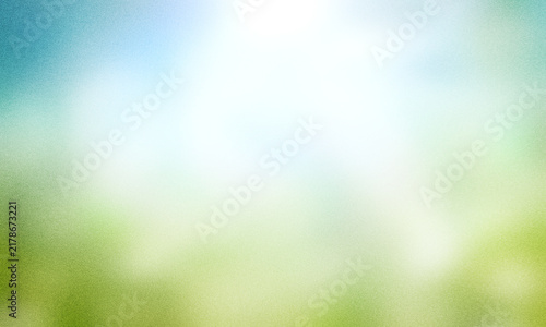 World environment day concept: green grass and blue sky abstract background with bokeh