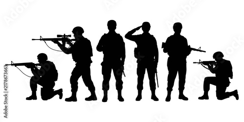 Photography Black silhouettes of a group of soldiers in various combat stances, holding rifl