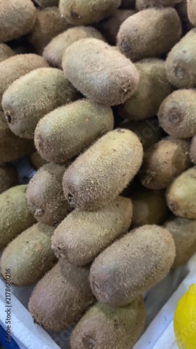 Many ripe kiwi as background