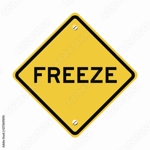 Yellow diamond shape sign with the text freeze written in bold black letters isolated on white background