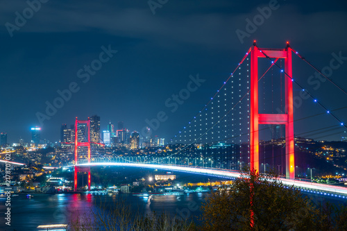 Night view of illuminated Bosphorus Bridge with city lights in background