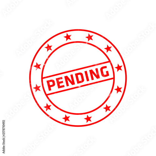 Fotografie Red circular rubber stamp with the word pending printed in bold capital letters,