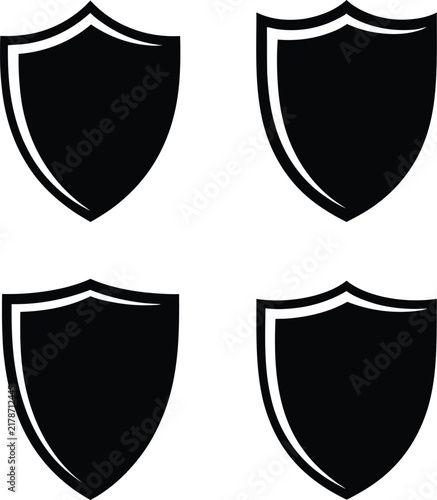 Four black medieval shields with white outline designs