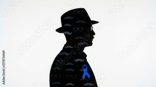 Silhouette Of A Man Wearing A Hat With A Pattern Of Mustaches And Glasses