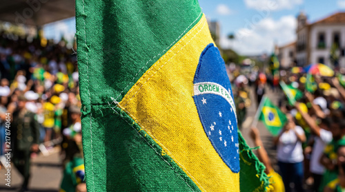 Brazilian flag waving with crowd