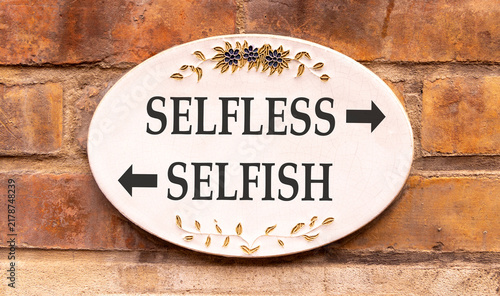 Фотография Selfless instead selfish words symbol