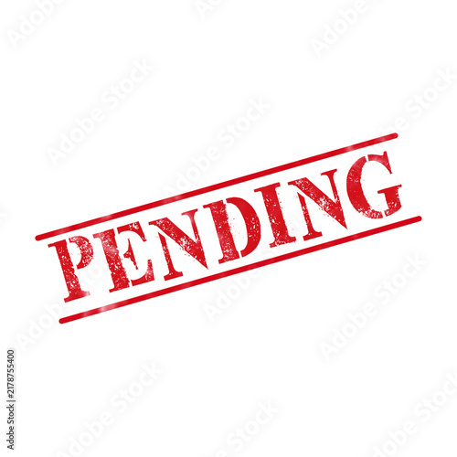 Fotografie Red ink rubber stamp with the word pending written in a bold font with a worn te