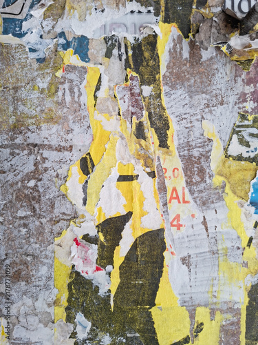Grungy, torn, and ripped street poster background, messy old paper artistic texture