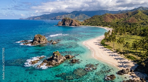Stunning ocean landscape featuring rugged rocks and tranquil sandy beach