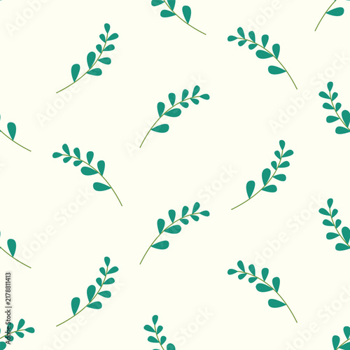 Green leaf branches forming a seamless pattern on cream background