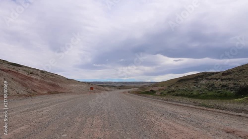 A dynamic clip shot from a moving car traveling along the road known as 