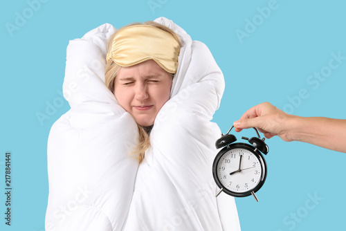 Quadro su tela Sleep deprivation and morning stress, woman wrapped in duvet with sleep mask ann