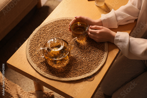 Canvastavla Mindfulness and self care, woman drinking herbal tea at home for relaxation and