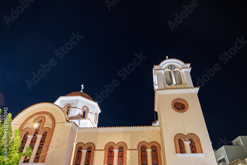 Принти на полотні Serene night scene of a traditional Eastern Orthodox church illuminated by warm