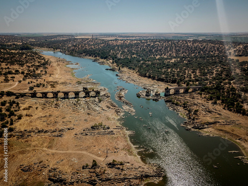 Fotografie Ponte da Ajuda Ruins Over Guadiana River, Alentejo Region, Portugal Drought