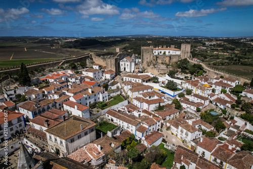 Картината върху платно Obidos Medieval Town and Castle Wall Overlooking Portuguese Countryside