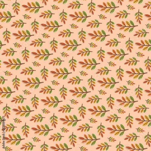 Seamless pattern with colorful autumn branches on peach background. Warm seasonal botanical print. 