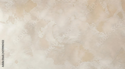 Close up of neutral beige plaster wall texture with subtle mottled pattern for elegant interior architecture and background design