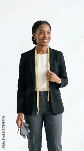 Confident Businesswoman Holding Fabric Swatch with Measuring Tape