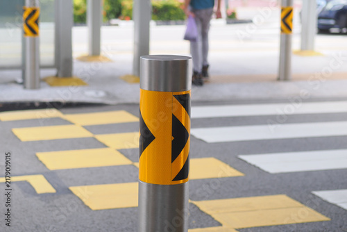 Obraz na płótnie Traffic pole with warning markings on street