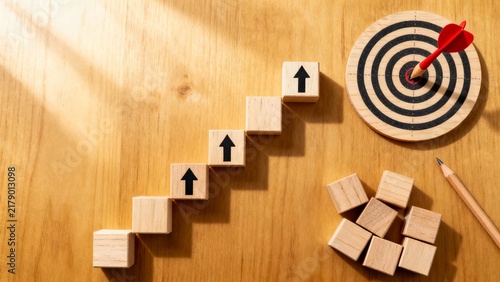 Wooden Staircase Blocks Leading Toward a Bullseye Target with Red Arrows