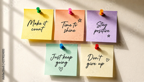 Konstfotografi Colorful motivational sticky notes pinned on light wall surface