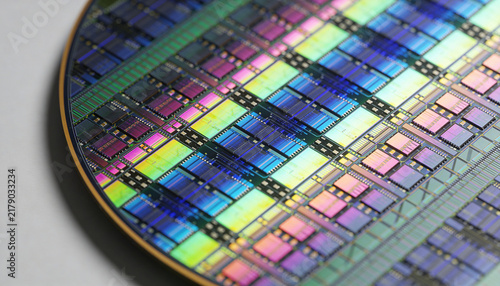 Macro view of a silicon wafer with integrated circuits for semiconductor manufacturing.