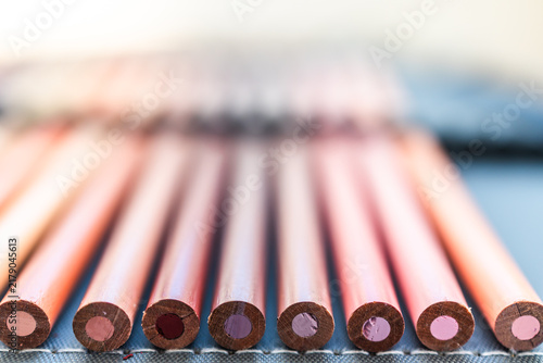 close-up of skin tone colored pencils neatly lined up in pencil case,  concept of creativity and drawing