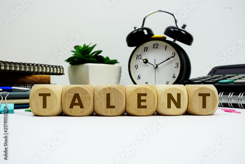 Fotografía TALENT alphabet letters with alarm clock and calculator on white background