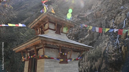 A religious shrine on the way to Annapurna base camp in Nepal. A holy or sacred place dedicated to a deity, saint, ancestor, or a specific religious event.