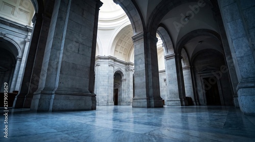 Classical interior featuring stone columns and arches, polished marble floor in majestic hall, history and grandeur concept.