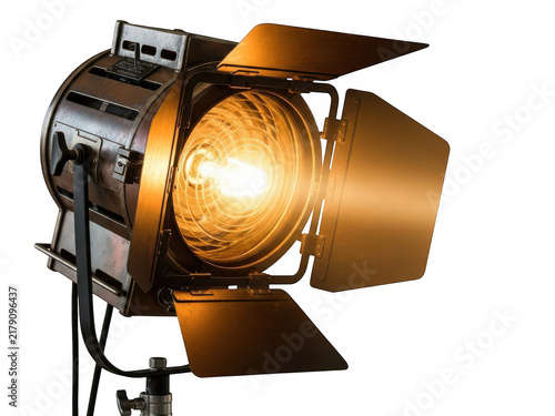Professional film stage spotlight with barn doors turned on isolated on transparent background