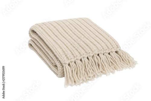 Fotografía Neatly folded beige knitted blanket with ribbed texture and fringe details is is