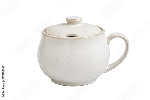 Obraz na płótnie Rustic white ceramic sugar bowl with a lid and handle, featuring a small notch f