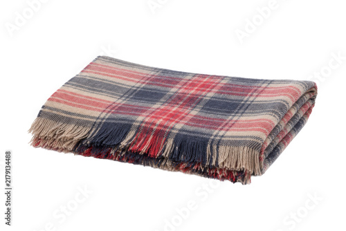 Fotografía Folded red, blue, and beige plaid blanket with fringed edges, captured with soft