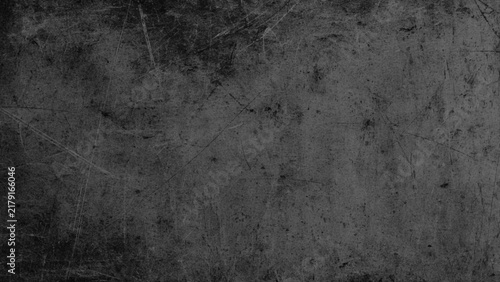 dark gray industrial texture with scratches scuffs and distressed worn surface resembling aged concrete or metal background