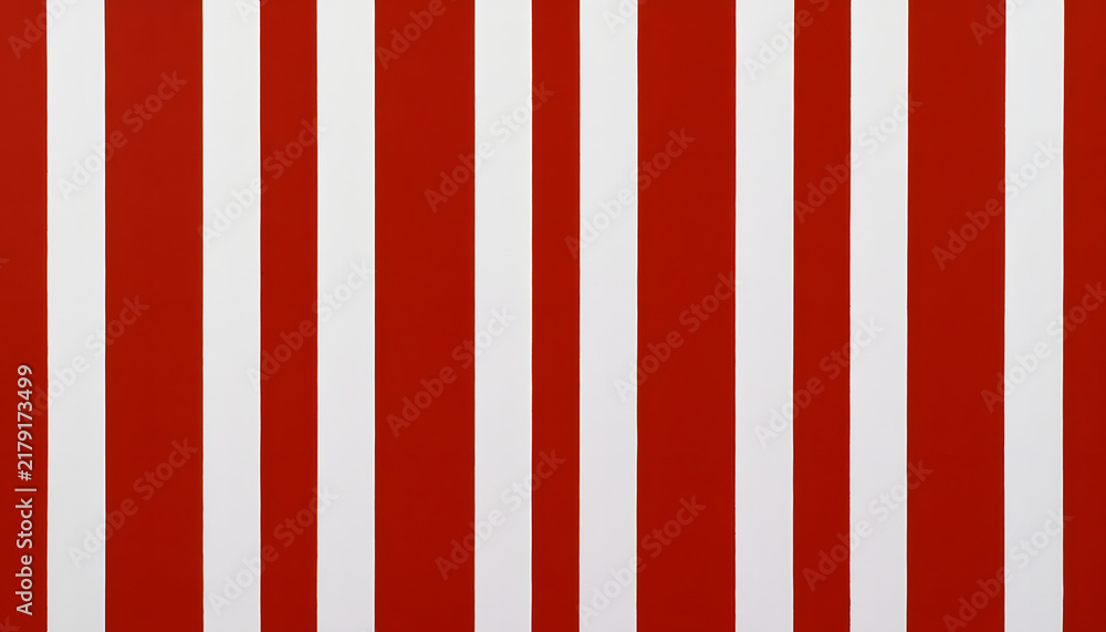 Fototapeta premium Vertical stripes that alternate between red and white create a repeating and striking design, establishing a visual flow and highlighting differences