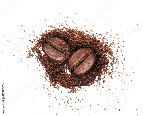 Roasted two coffee beans with coffee powder close-up isolated on a transparent background