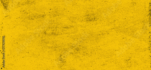 Distressed yellow grunge background with heavy dark scratches, dust, and worn surface texture