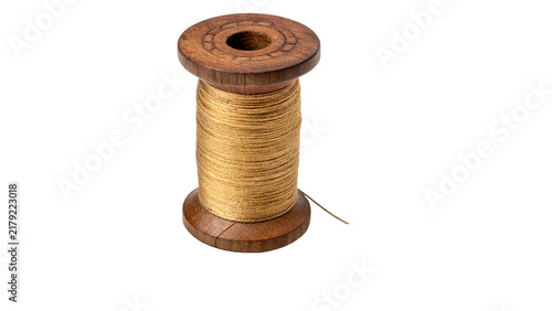 Obraz na plátně Vintage wooden sewing thread spool wrapped with gold or brown shiny craft twine