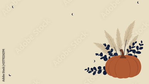 Cozy autumn background with an orange pumpkin and dried flowers in muted neutral tones