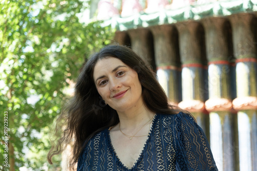 Bild auf Leinwand Beautiful adult Armenian woman looking directly at camera with gentle smile outd