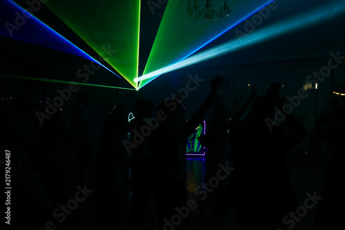Unrecognizable people dancing in a nightclub
