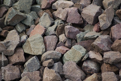 Фотография Full frame top view texture background of grey crushed granite stone gravel for construction and landscape design